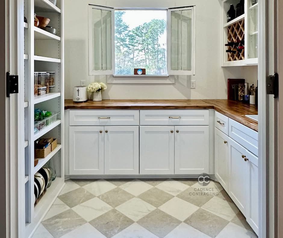 Custom butler's pantry with butcher block countertops, checkered tile floor and built-in wine rack