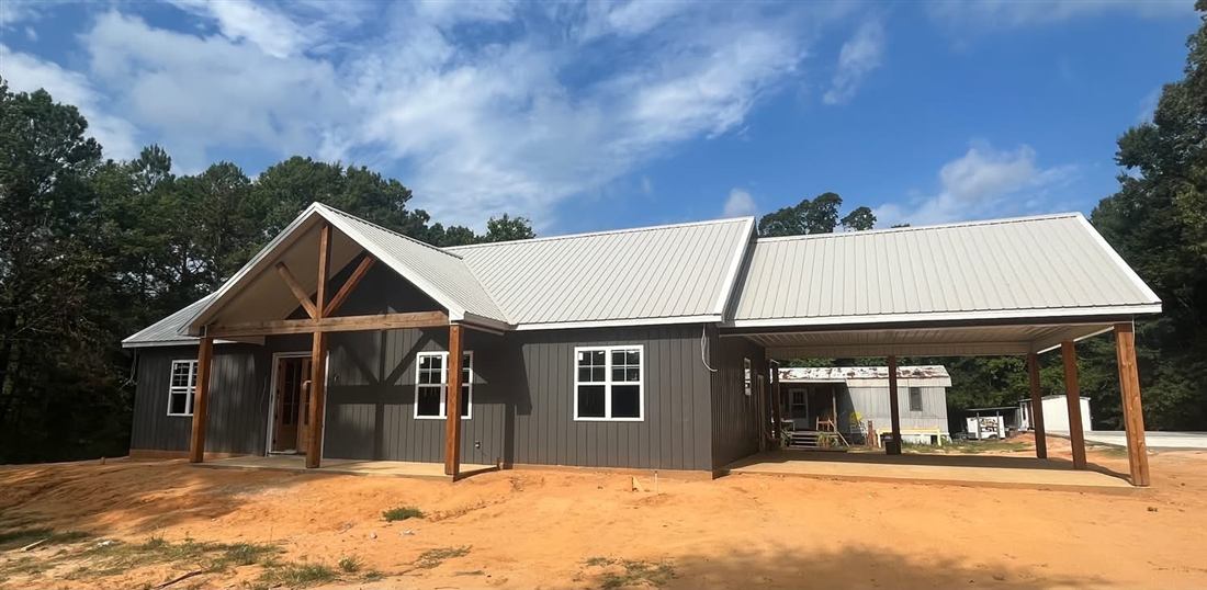 The Silo Project — grain silo home conversion kitchen with brick walls and huge island